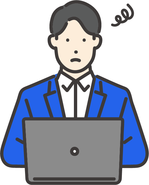 スーツを着た男性がノートパソコンを使っている